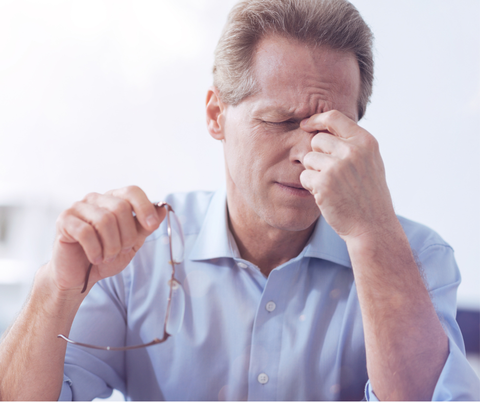 Man holding bridge of nose